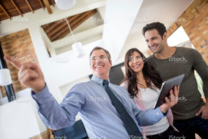 stock-photo-64831583-real-estate-agent-showing-house-to-a-couple